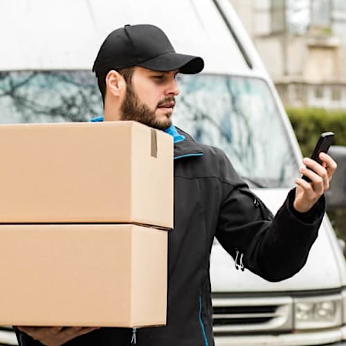 1626352949 Shutterstock 609236609 Delivery Man W Phone V3 — commercial security installed by Kingsedco in Texas